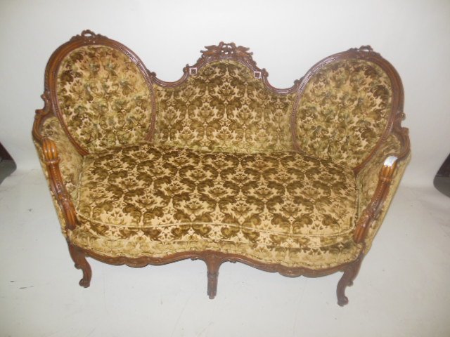 Rare matched pair of French style Louis XV settees: Rare matched pair of French style Louis XV fruitwood carved settees with bird crests. These are a wonderful pair! They each measure 36" high x 56" wide x 23" deep.