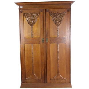 Art Nouveau Carved Wood Wardrobe: Art Nouveau Carved Wood Wardrobe Beautiful Oak Art Noveau Wardrobe with fitted interior including 4 drawers, 3 slide out shelves, rod, trunkspace and 5 brass hooks. Exceptional. Measures 82.5" High x