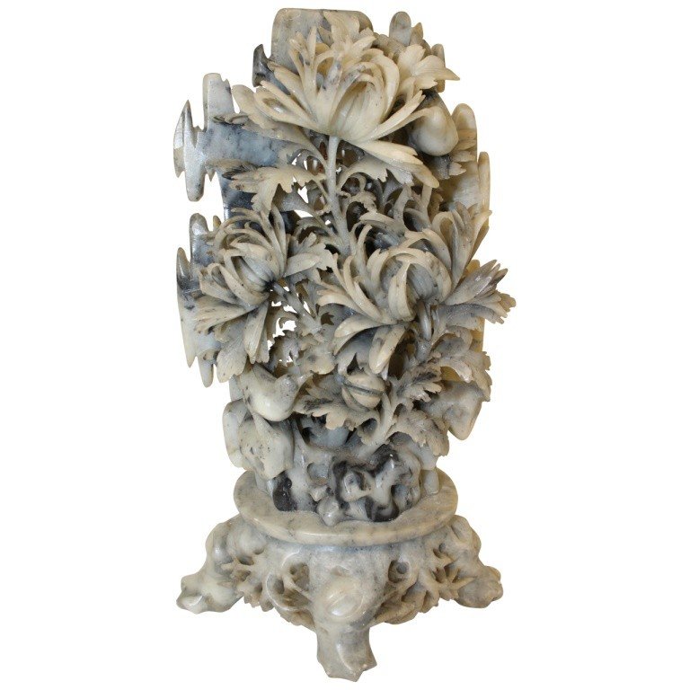 Soapstone Sculpture: Exceptional carved 3 dimensional floral soapstone with carved legs and birds. Grayish black in color. Measures 13.25" h x 7" w x 4.25" d. In very good condition with minor marks consistent with age.