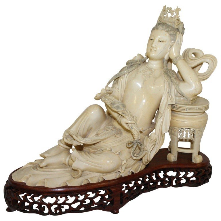 Bone Figure of Guan Yin, Chinese Goddess of Mercy: Well carved Chinese figure of reclining goddess Guan Yin. Measures 12"h x 13"l x 5.5"d. Circa early 20th c., China. In very good condition with minimal wear due to history.