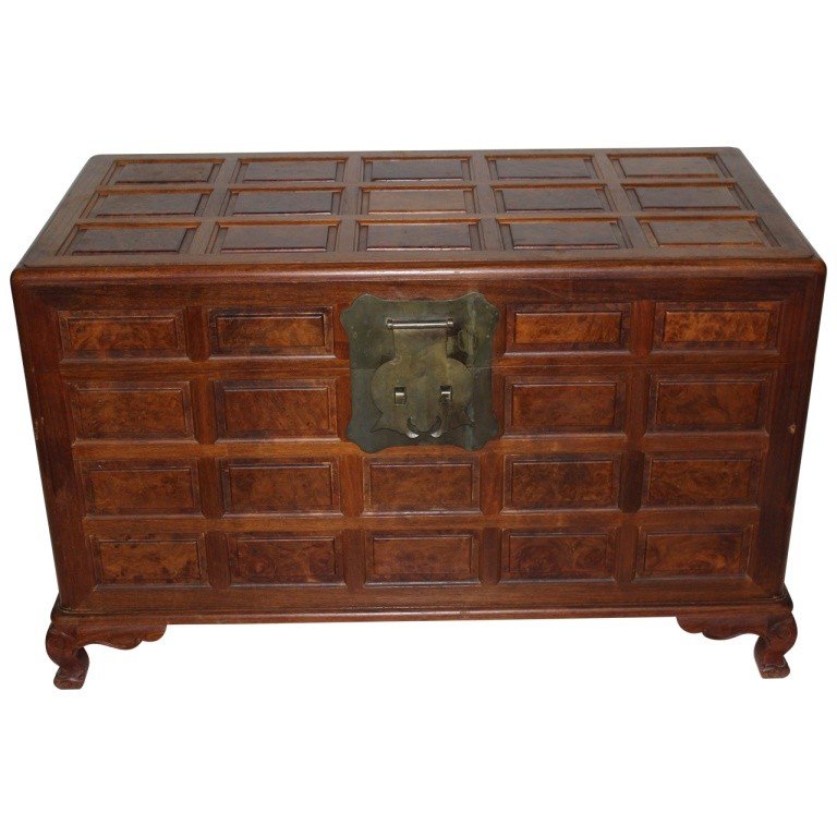 Chinese Camphor Wood Blanket Box: Camphor wood blanket box with all over burl walnut raised panels, paw feet and brass decorated locks. Measures 25"h x 40"l x 19.75"d. In excellent condition with minimal wear consistent with history.