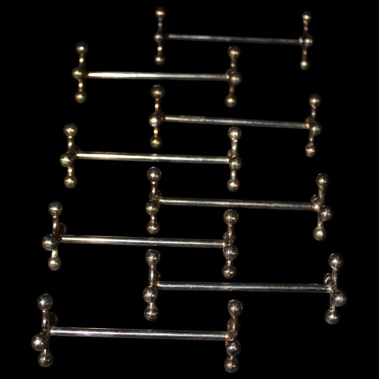 Christofle Silverplated Knife Rests: Set of 8 MCM Sputnik knife rests by Christofle of France. Each measures 4"l x 1"w x .5"d. In excellent condition.