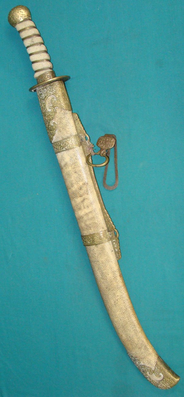 Antique Chinese Sword: Antique Chinese Sword. Shagreen Scabbard. Complete. Length of the blade is 19". Total length is 26 1/2".