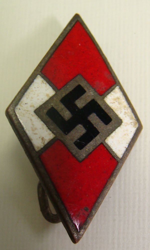 German HJ Party Badge: German HJ Party Badge. Marked M1/42 and RZM on the back. Slightly dusted, but undamaged enamel.