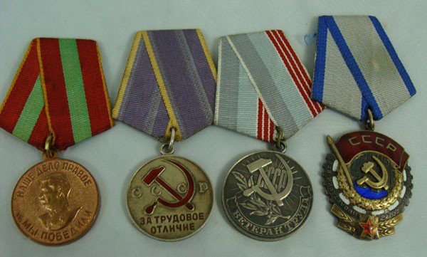 Group of Soviet Russian Medals and Orders: Group of four Soviet Medals and Orders including Order of the Red Banner of Labor.