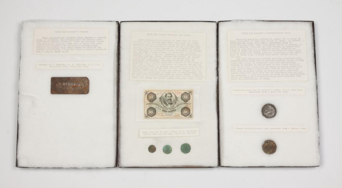 Civil War Identified Items: Civil War Identified Items. Including ID disc of George W. White, Co. I, 56th MA; stencil of J. Herrick, Co. E, 13th Regiment NY Volunteers; Tokens of M. Sullivan Sutler for 55th Regiment Ohio Volunte