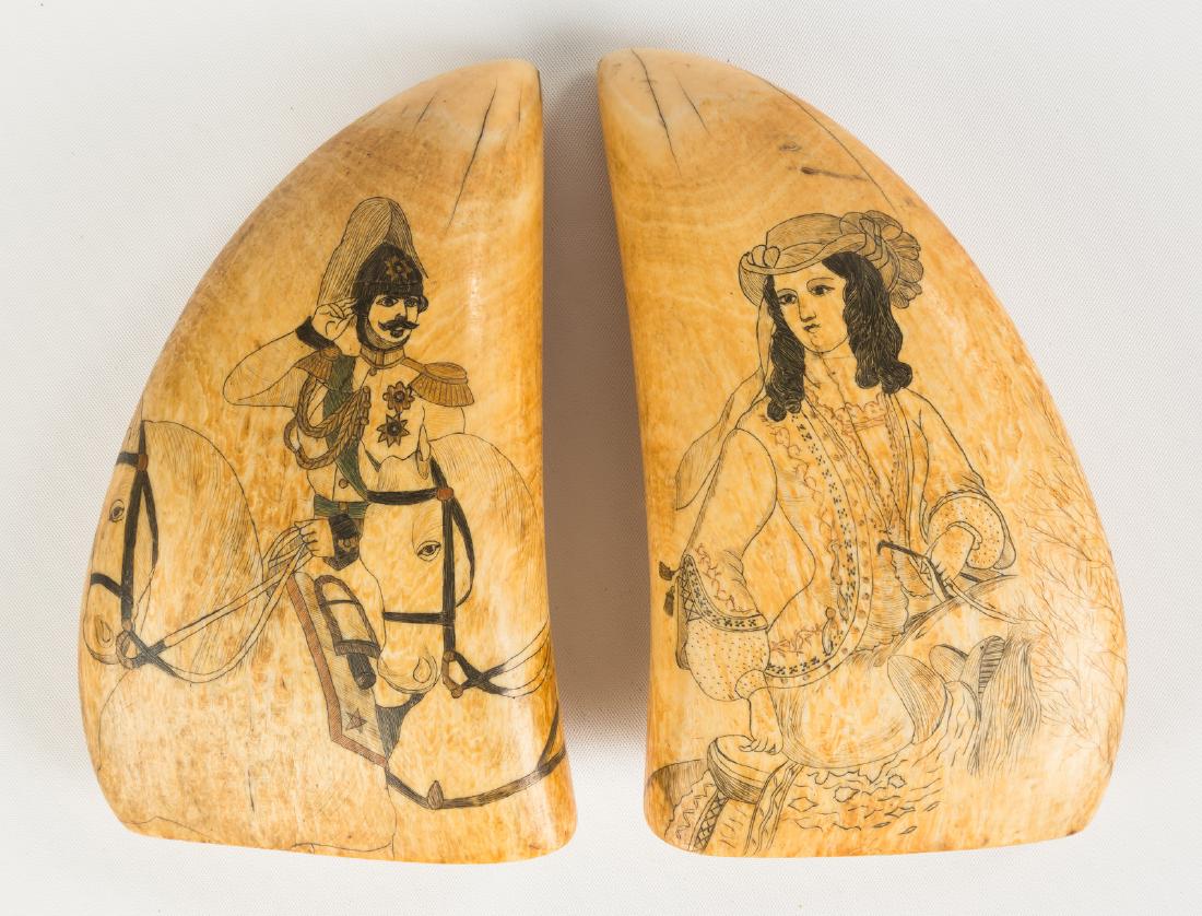 Pair of 19th C. Polychrome Scrimshaw Whales Teeth: Decorated with military figure and woman in gown on horseback. L 5 1/2" x W 3 1/2". The Dr. Gregory Zemenick Collection, Michigan.Please note that this lot is limited to US buyers only and the final s