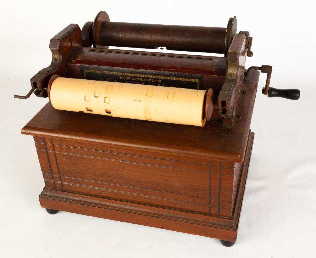 Clariona Reed Hand Organ: Extra rolls. Ht. 10 1/2" W 12" .