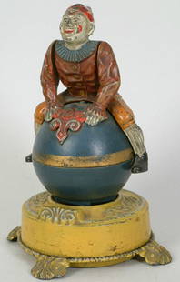 Clown on Globe Mechanical Bank: Clown on Globe Mechanical Bank, 9" (h) orig. paint, exc. cond., Est. 3,000-5,000.