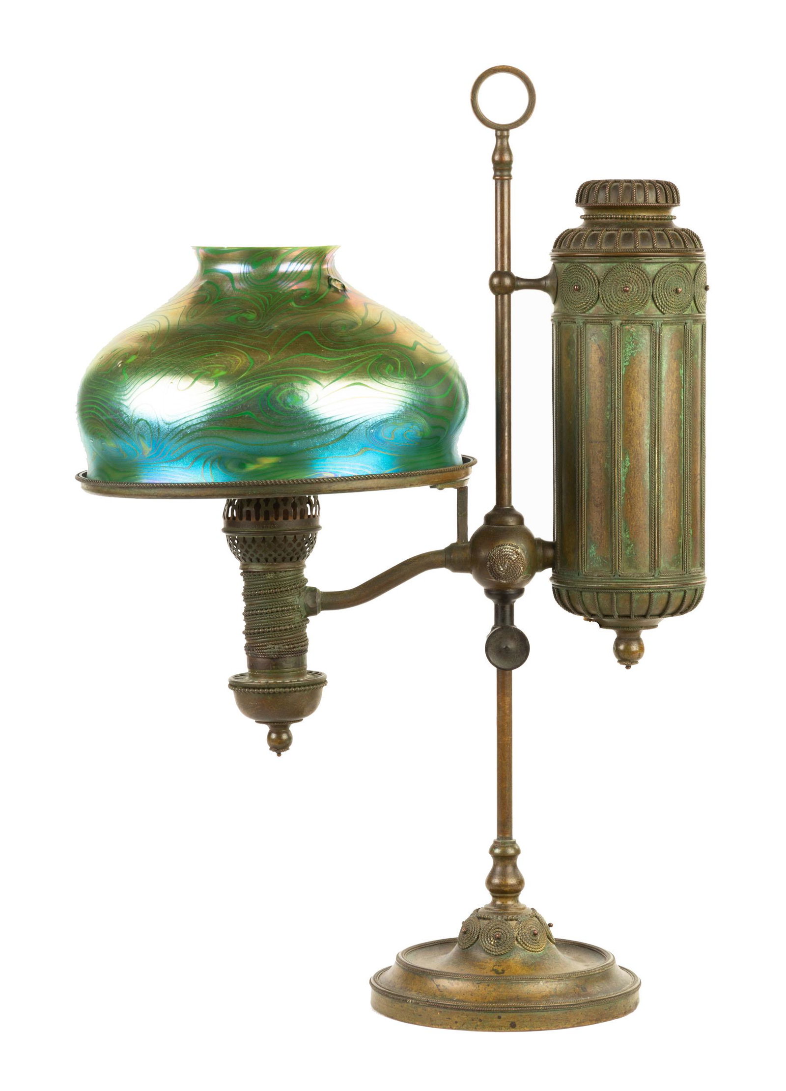 Tiffany Studios, NY Brass Single Student Lamp with: Tiffany Studios, NY Brass Single Student Lamp with Shade. Early 20th century. Patinaed bronze base with glass shade. Ht. 25" Shade D 10".