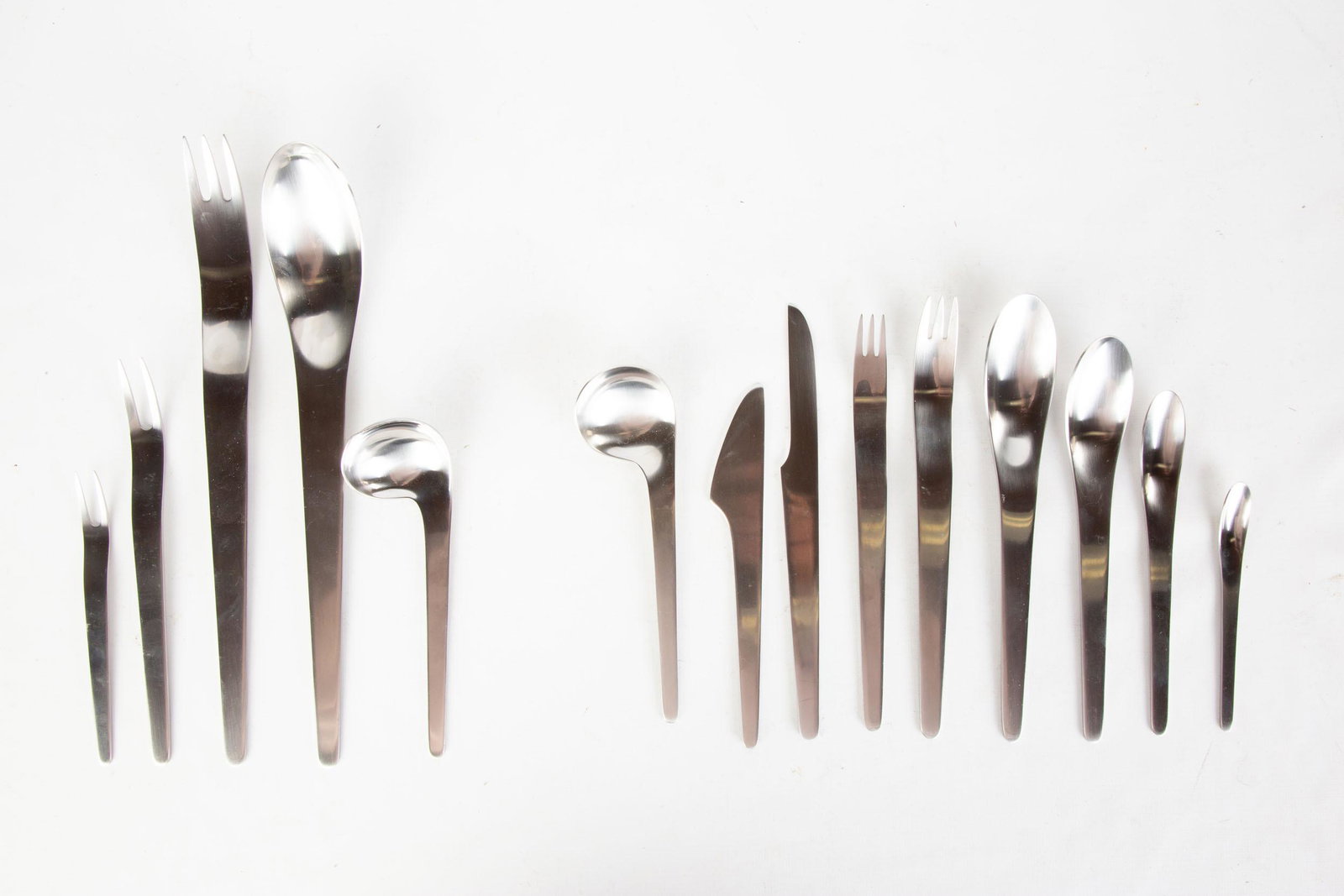 Georg Jensen Service of Twelve Stainless Steel: Georg Jensen Service of Twelve Stainless Steel Flatware Arne Jacobsen Pattern. Including misc. serving pieces. 113 pieces. Max L 11 1/2" The Lorraine & Sy Merrall Collection, Rochester, NY