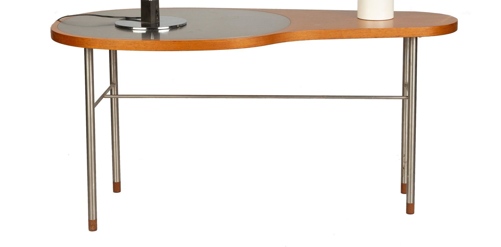 Finn Juhl (Danish, 1912-1989), "Ross Coffee Table": Finn Juhl (Danish, 1912-1989), "Ross Coffee Table" Walnut with stainless steel inlay, stainless steel legs and wooden toes Ht. 23", W 48", D 23" From the estate of Inger-Marie Tanier & George Tanier, 