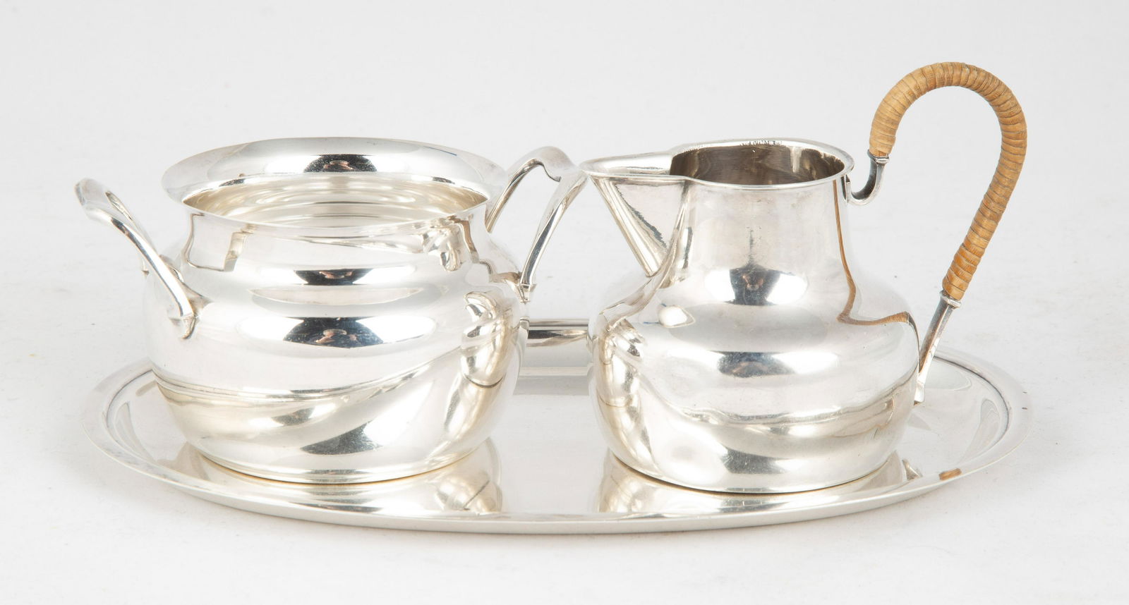A. Michelsen Sterling Sugar, Creamer and Tray: A. Michelsen Sterling Sugar, Creamer and Tray 11.8 ozt. Max Ht. 3" W 7 1/2" From the estate of Inger-Marie Tanier & George Tanier, Knight of Dannebrog, thence by descent to present owner.