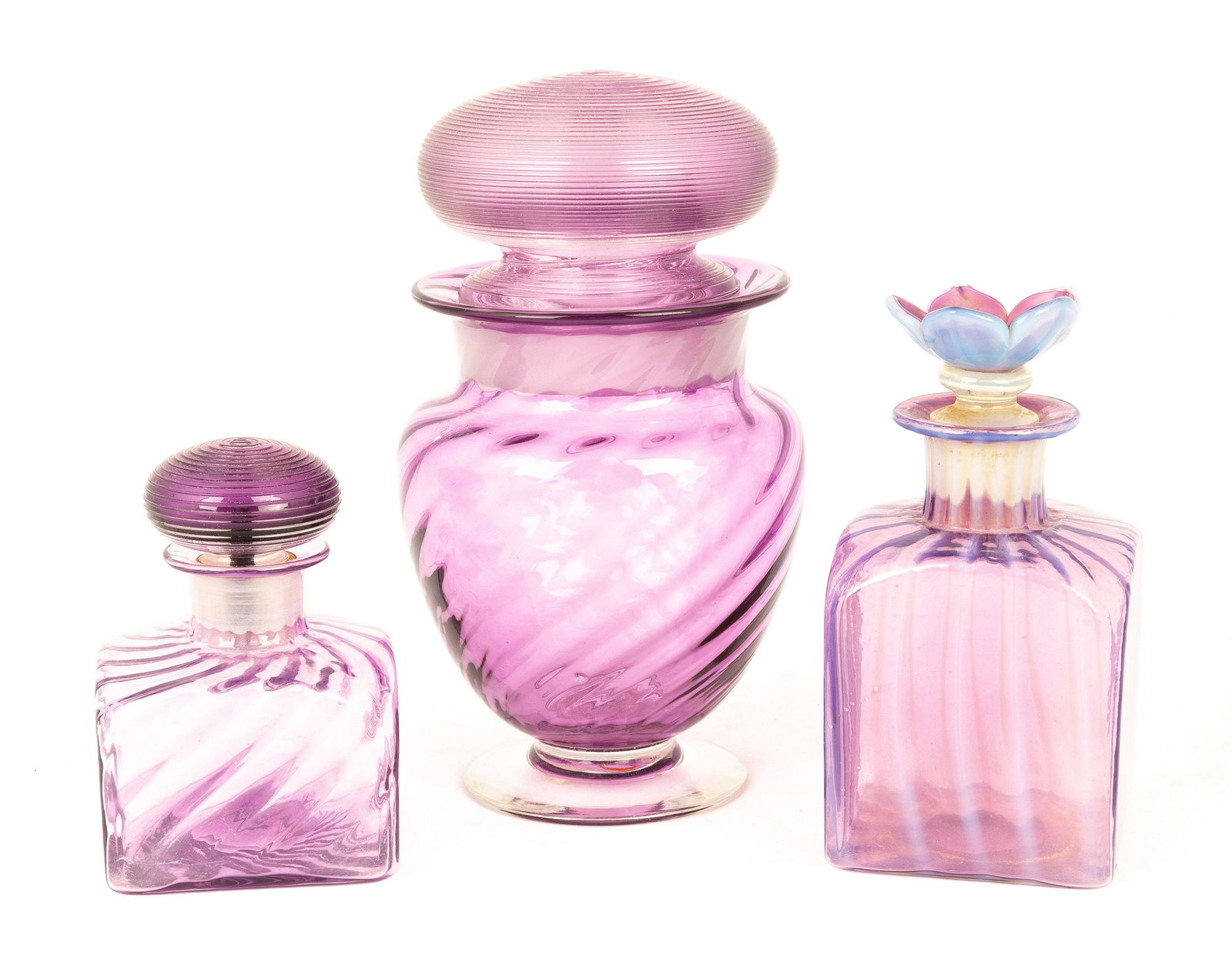 Three Steuben Amethyst Pieces: Three Steuben Amethyst Pieces Corning, NY. Two colognes and one covered jar. Jar signed 'Steuben'. Max Ht. 7" The Frank & Amy Blake Collection, formerly of Corning, New York.
