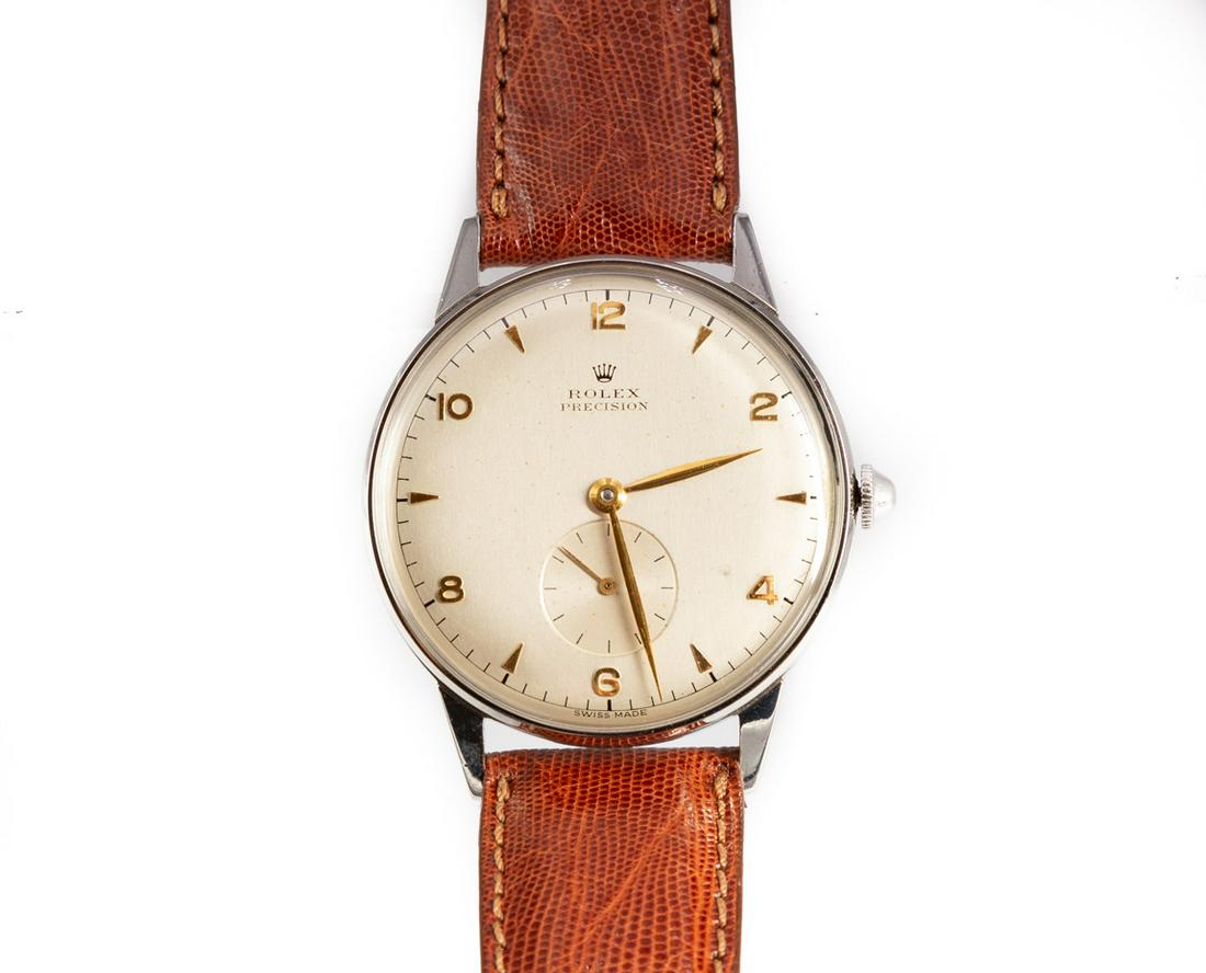 Rolex Precision Steel Wrist Watch: Rolex Precision Steel Wrist Watch With silvered dial and Arabic numbers. No. 823861. Teju Lizard band. Buckle not original. 35mm A New York, New York estate. For new customers purchasing silver, gold,