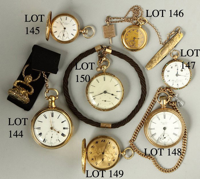 Center - English Open Face Pocket Watch w/Hair Fob: 14 k. Interior of case #535. Swinging movement, key wind. Dia. 2"