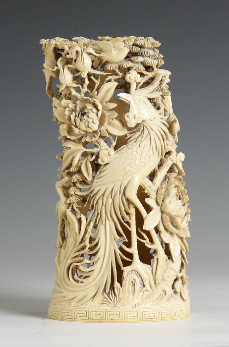 Large Chinese Carved Ivory Tusk w/Cranes: 19th cent. Elaborately carved and pierced, hollow. Depicting cranes in an oriental pine and a phoenix among flowers. Ht. 10"