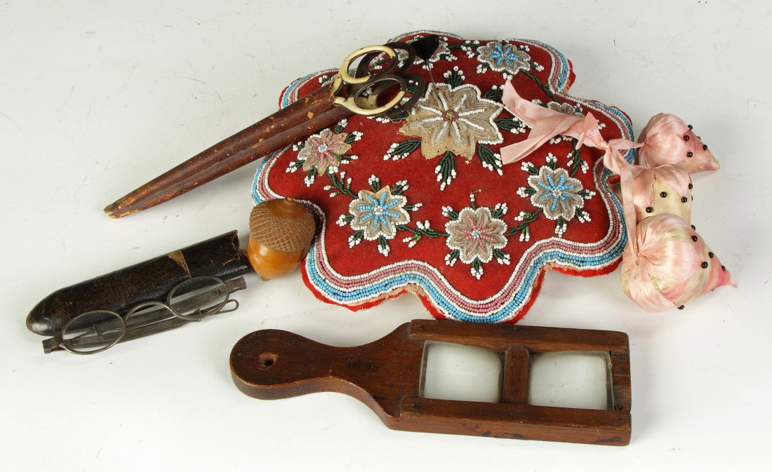 Misc. Sewing Accessories: Incl. pin cushions, tape measure, thimble, magnifiers, scisors, etc. Pin cushion W 9" From the collection of the former Campbell-Whittlesey House Museum.