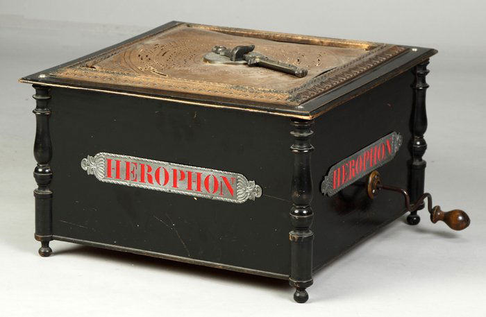 Herophon Disc Roller Organ: Black lacq case in original condition. (3) 13" square paperboard records. Dr. Richard Pope Ht. 12" W 19" D 19"