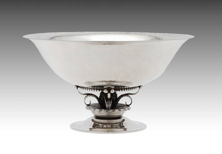 A Georg Jensen Silver Centerpiece Bowl: A Georg Jensen Silver Centerpiece Bowl circa 1945, Design 234C. A hand hammered sculptural bowl on an openwork raised foot. Weight: 18.5 troy ounces. Ht. 4 1/4 in. Dia. 8 in. Hugh Barclay (1893-1968)