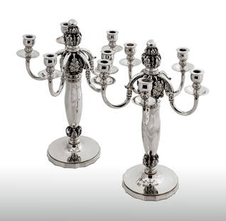 Pair of Fine and Rare Silver Five-Light Candelabra, Georg Jensen: Pair of Fine and Rare Silver Five-Light Candelabra, Designed by Georg Jensen, Mark of Georg Jensen, Cophenhagen, 1925-1932 Each on a circular base with incurved sides, the vase-shaped stem with