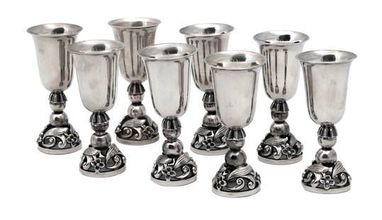 Eight Georg Jensen Silver Cordials: Eight Georg Jensen Silver Cordials Marked Georg Jensen U.S.A. L.P. Sterling 100. Floral cordial cups, designed by Alphonse La Paglia for Georg Jensen. In original case. Weight: 11.8 troy ounces. Ht. 3