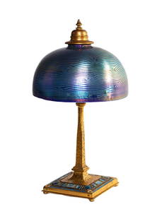Tiffany Studios Art Deco Damascene Table Lamp: Tiffany Studios Art Deco Damascene Table Lamp Circa 1900. Patinaed, gilt and enameled bronze. Favrile decorated and damascene glass. Shade signed L.C.T. Ht. 14 1/2 x W 8 in.
