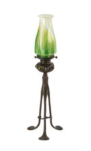 Tiffany Studios Jeweled Candlestick with Pulled Feather Shade: Tiffany Studios Jeweled Candlestick with Pulled Feather Shade Circa 1905. Patina bronze and favrile glass. Bronze impressed TIFFANY STUDIOS NEW YORK 1228. Shade signed L.C.T. Ht. 16 1/2 in.