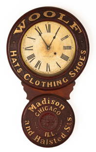 Baird Advertising Wall Clock: Baird Advertising Wall Clock Baird Clock Co., Plattsburg, New York, late 19th century. Pressed paper mache case, paper dial, spade hands, 8-day, time only, spring driven brass movement. Ht. 31 in.