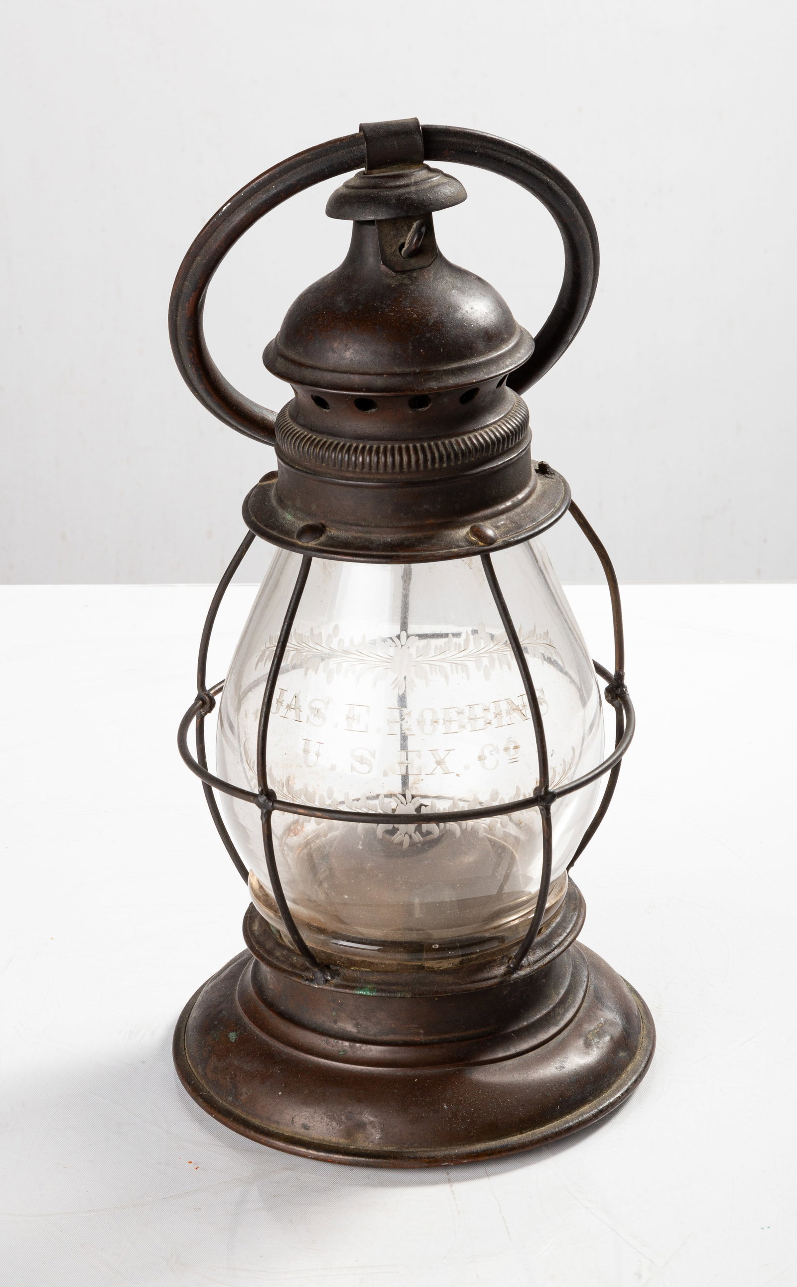 19th Century Presentation Railroad Lantern: 19th Century Presentation Railroad Lantern Brass with etched glass globe, "JAS E. ROBBINS / U.S.EX. CO" tin whale oil burner. Max Ht. 17 in. The Collection of Mr. John Minoia, Apalachin, New York.