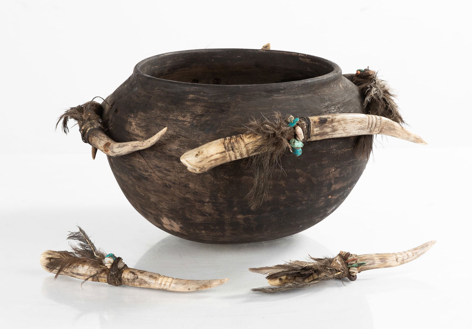 Zuni Fertility Fetish Bowl: Zuni Fertility Fetish BowlMade by Teddy Wieuka (Zuni Pueblo), circa 1930. Earthenware, bone, beaded, feathered.Max 8 x 14 in.ProvenanceA Private Boston, Massachusetts collection.
