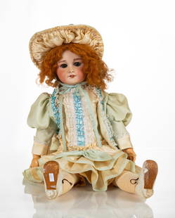 French Jumeau Doll: French Jumeau Doll Circa 1885. Bisque porcelain, blown paperweight eyes, and pierced ears. With composition body. Head marked 'Tete Jumeau'. Ht. 26 in.