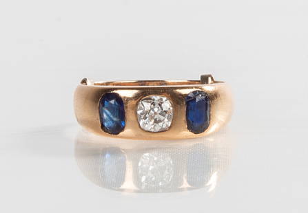Men's 18K Gold, Diamond, & Sapphire Ring: Men's 18K Gold, Diamond, & Sapphire Ring Old mine cut diamond and two sapphires. Diamond is approximately .5 ct. Weight: 7.16 grams. Purchase Note: New customers purchasing silver, gold, or jewelry ar