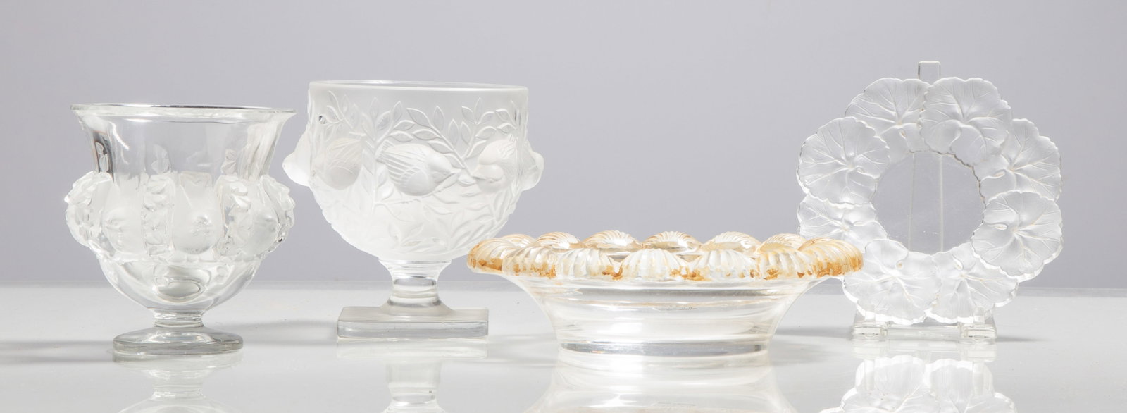 Lalique Art Glass: Lalique Art Glass France, 20th century. Molded and frosted glass. Engraved or acid stamped signature. Max Ht. 5 1/4 in. A Buffalo, New York estate.