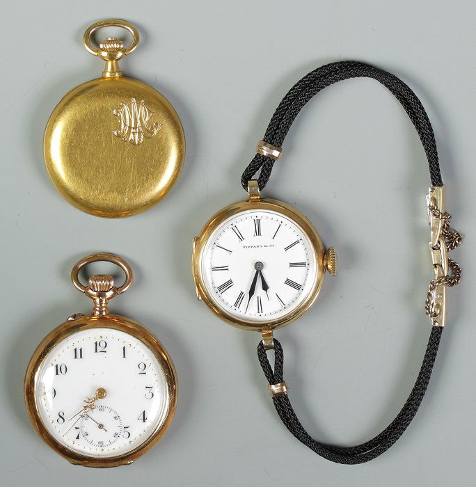 Two Pocket Watches and One Wrist Watch: Two Pocket Watches and One Wrist Watch. Clockwise: 18K gold J. Borbolla, Habana, second bit hand, monogramed, 14.7 dwt. Tiffany & Co,18K gold, monogrammed, 15.2 dwt. Ancre Ligne Droite 15 jewel, 18K g