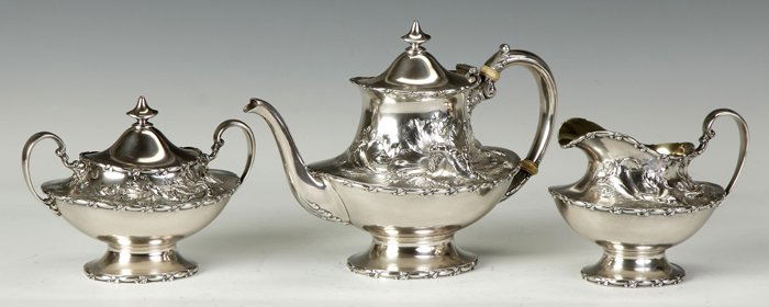 Reed & Barton 3-Pc. Sterling Silver Tea Set: Reed & Barton 3-Pc. Sterling Silver Tea Set. Hand chased & repousse hibiscus. Monogrammed. Total 45.9 ozt. Max. Ht. 7 1/2". Property from The Strong, sold to benefit the museum's collections fund.