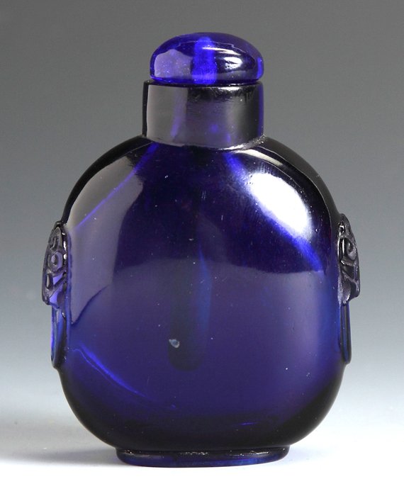 Cobalt Blue Glass Snuff Bottle: Cobalt Blue Glass Snuff Bottle. Sgn., with foo dog handles. Ht. 2 1/2".