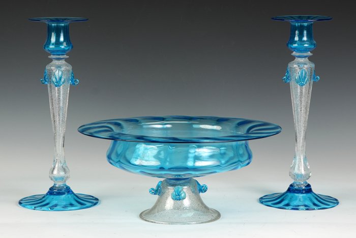 Steuben Celeste Blue & Clear Mica Fleck Glass Compote &: Steuben Celeste Blue & Clear Mica Fleck Glass Compote & Matching Candlesticks. Candlestick Ht. 12"; Compote Ht. 5 1/2"; Dia. 12 1/2". Property from The Strong, sold to benefit the museum's collections