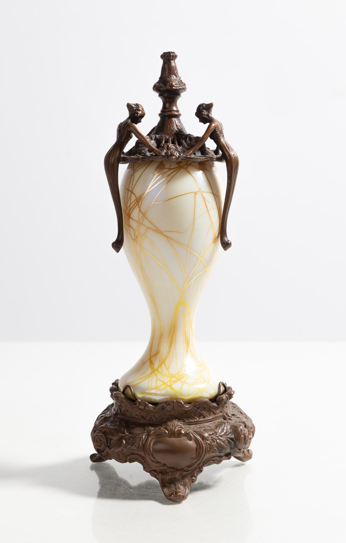 Steuben Art Nouveau Boudoir Lamp: Steuben Art Nouveau Oil Lamp Corning, New York, circa 1905. Blown glass. Patinaed metal mounts marked 'W. E. Manufacturing Company' (to underside). Ht. 11 1/2 in. The collection of Bill Mehlenbacher (