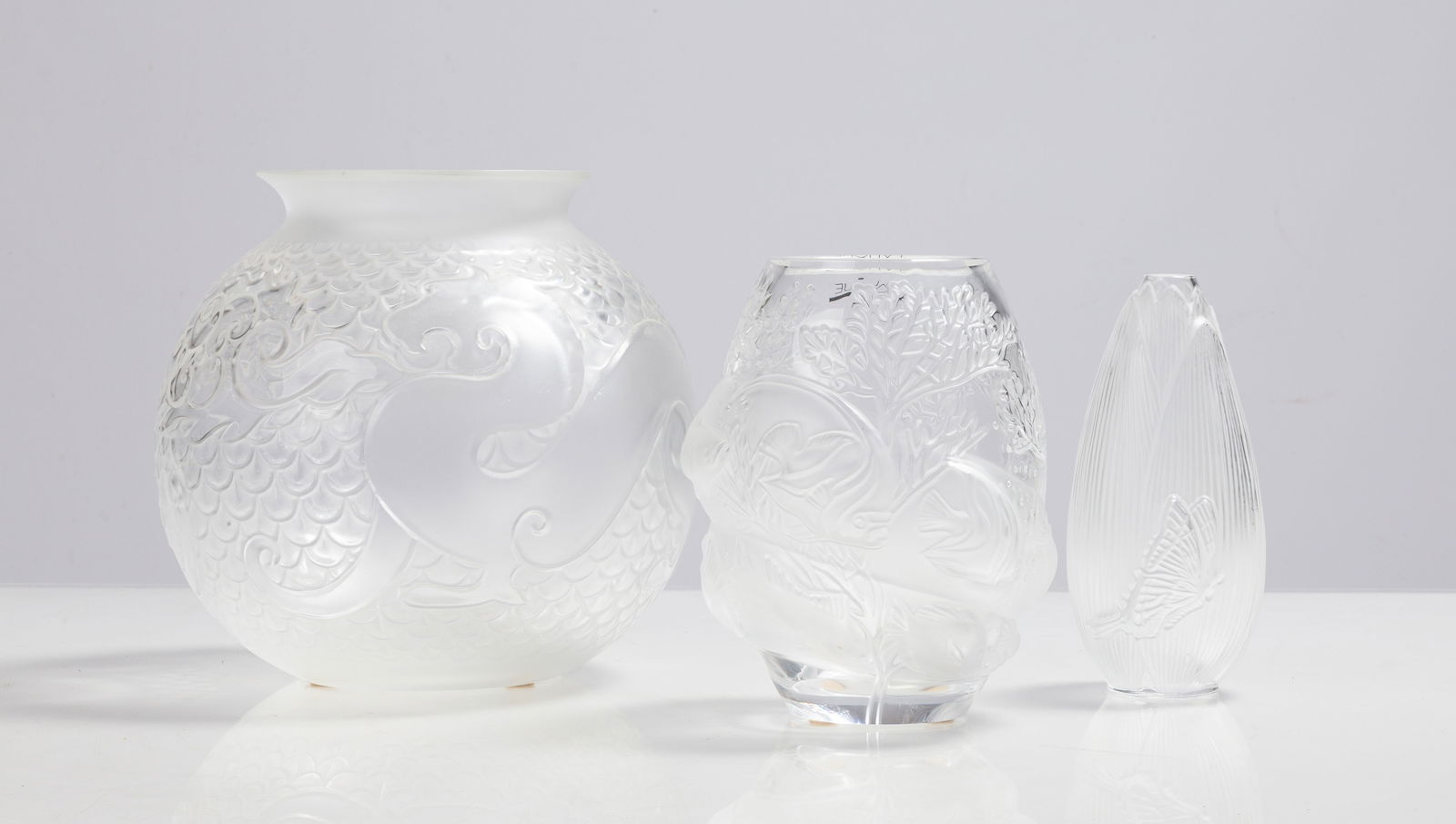 Lalique Coeur de Fleur, Tarpoon, & Xian Dragon Vases: Lalique Coeur de Fleur, Tarpoon, & Xian Dragon Vases 20th century. Molded and frosted glass. Inscribed signature 'Lalique France'. Max Ht. 8 in. Private collection, Buffalo, New York. Shipping Note: W