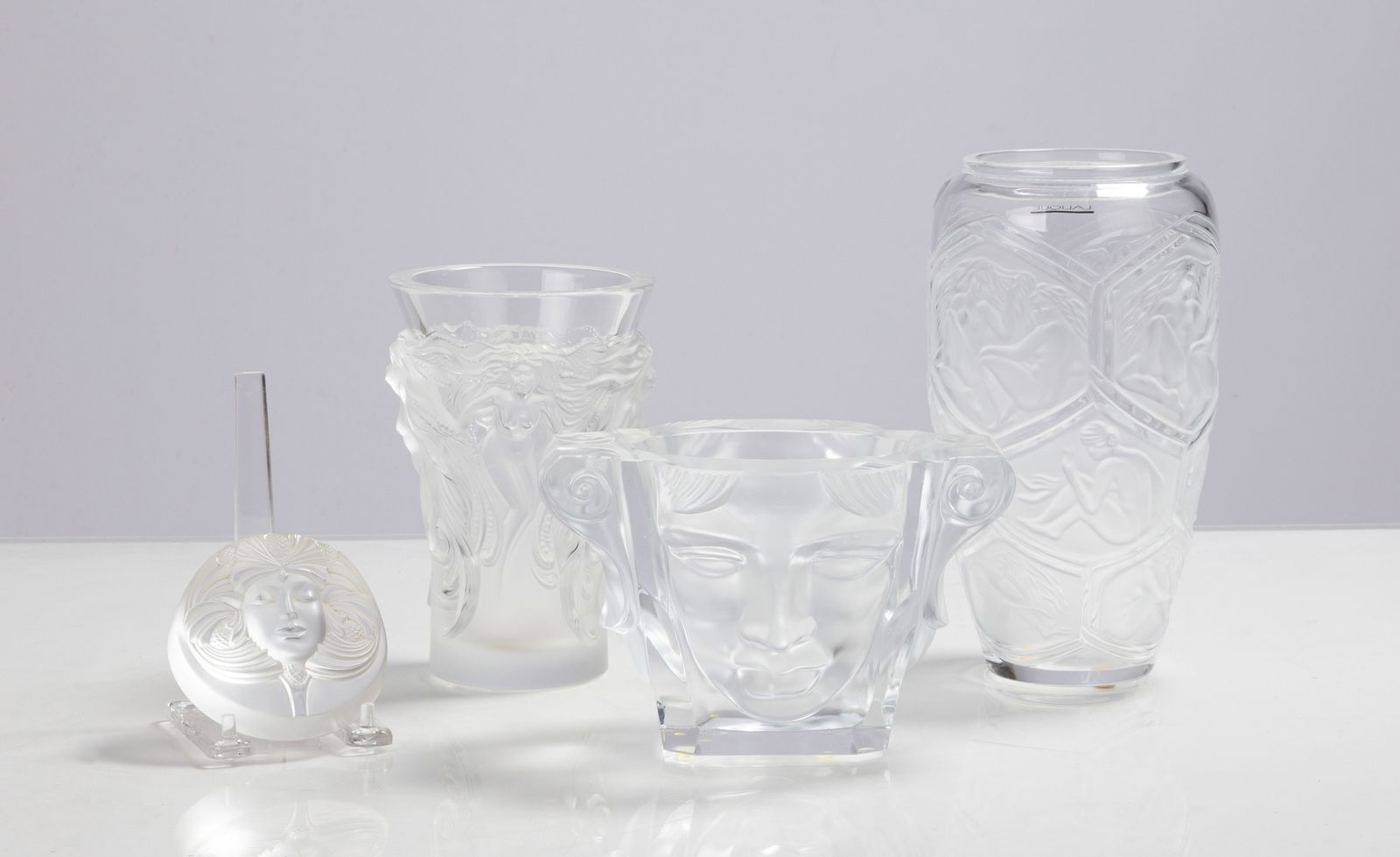 Lalique Psyche Paperweight, Fantasia, Hesperides Vases & Halama Alexandrite Vase: Lalique Psyche Paperweight, Fantasia, Hesperides Vases & Halama Alexandrite Vase 20th century. Molded and frosted glass. Inscribed signature 'Lalique France'. One inscribed 'Halama'. Max Ht. 9 in. Pri