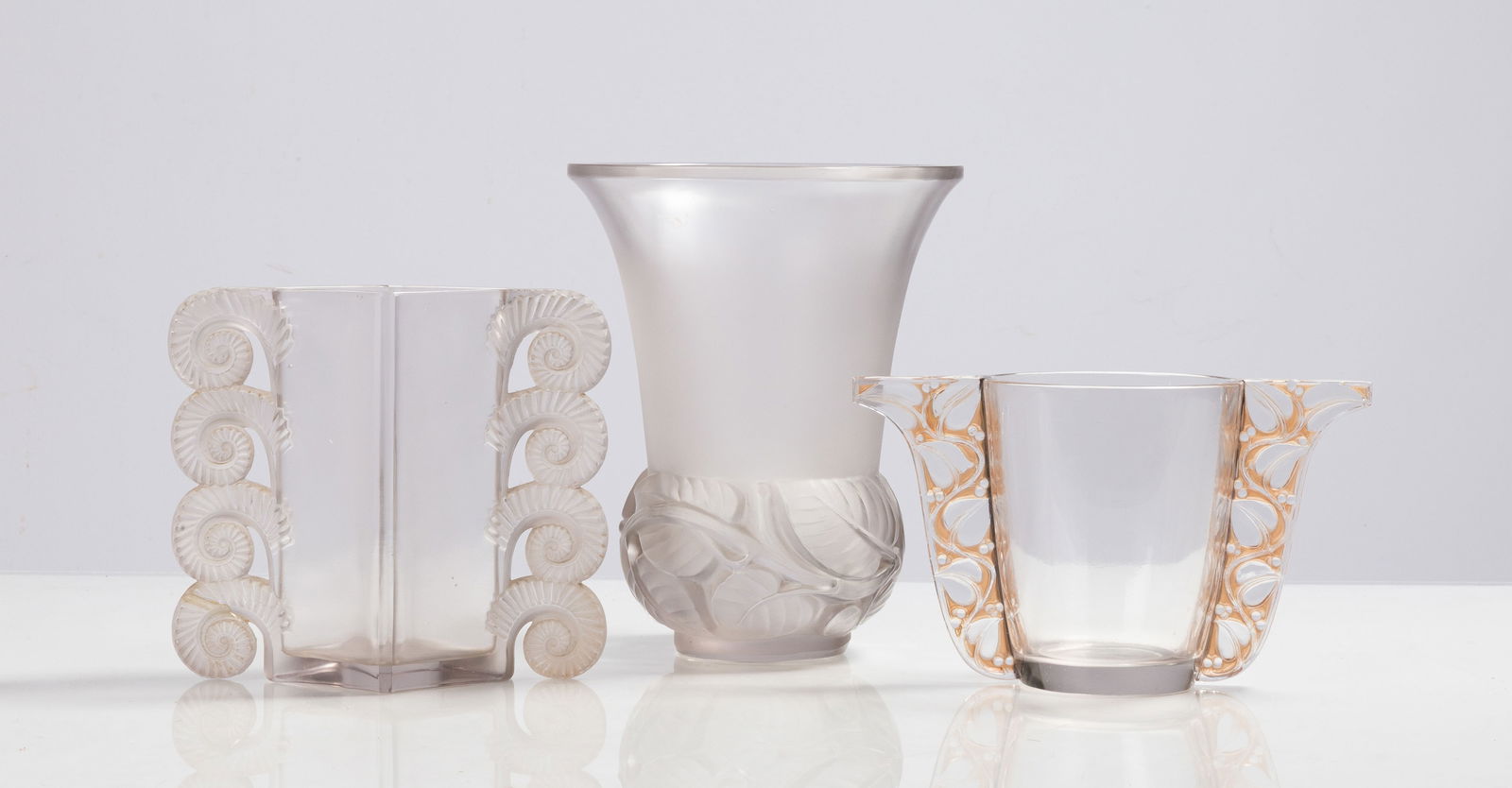 Rene Lalique Amiens, Lias (Lilac), & Honfleur Vases: Rene Lalique Amiens, Lias (Lilac), & Honfleur Vases 20th century. Molded and frosted glass. Inscribed signature 'Rene Lalique France'. Max Ht. 9 3/4 in. Private collection, Buffalo, New York. Shipping