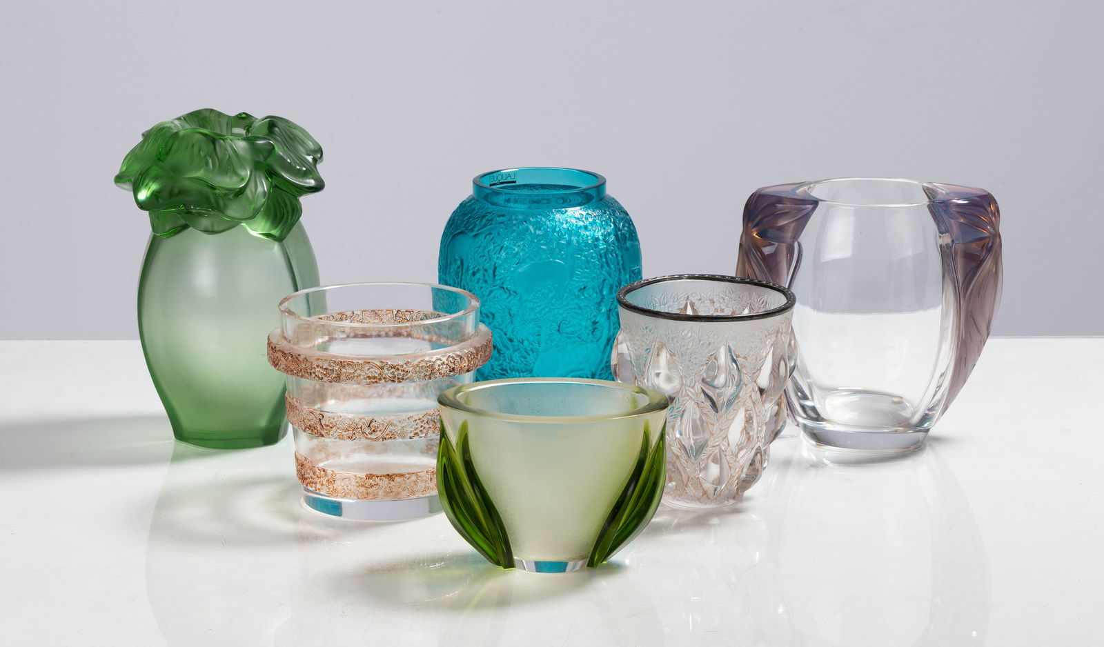 Lalique Saint Barth, Biches, Clematites, Ricquewihr, Rampillon, & Deux Tulipes Vases: Lalique Saint Barth, Biches, Clematites, Ricquewihr, Rampillon, & Deux Tulipes Vases 20th century. Molded and frosted glass. Inscribed signature 'Lalique France'. Max Ht. 8 1/2 in. Private collection,