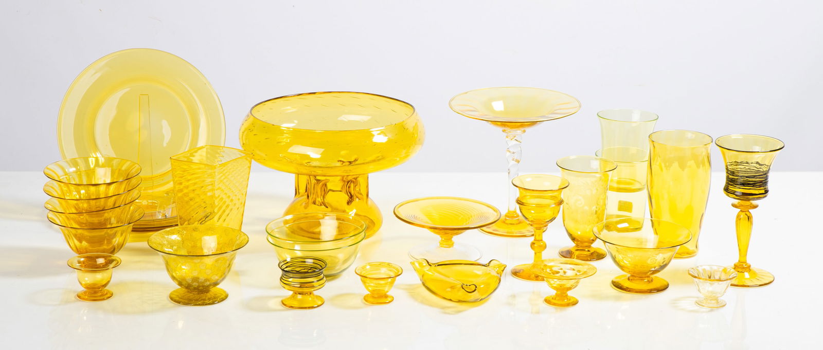 Steuben Bristol Yellow Tableware: Steuben Bristol Yellow Tableware Corning, New York, early 20th century. Blown glass. Including some Silverina. Engraved and threaded pieces. Max Ht. 8 1/2 in. The collection of Bill Mehlenbacher (1943