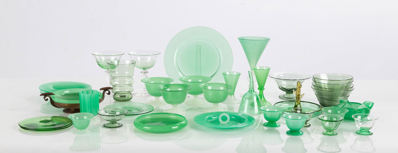 Steuben Green Jade Tableware: Steuben Green Jade Tableware Corning, New York, early 20th century. Blown glass. Green jade, alabaster, amber, verre de sois, and clear. Including plates, tumblers, stemware, cordials, sherbets, salts