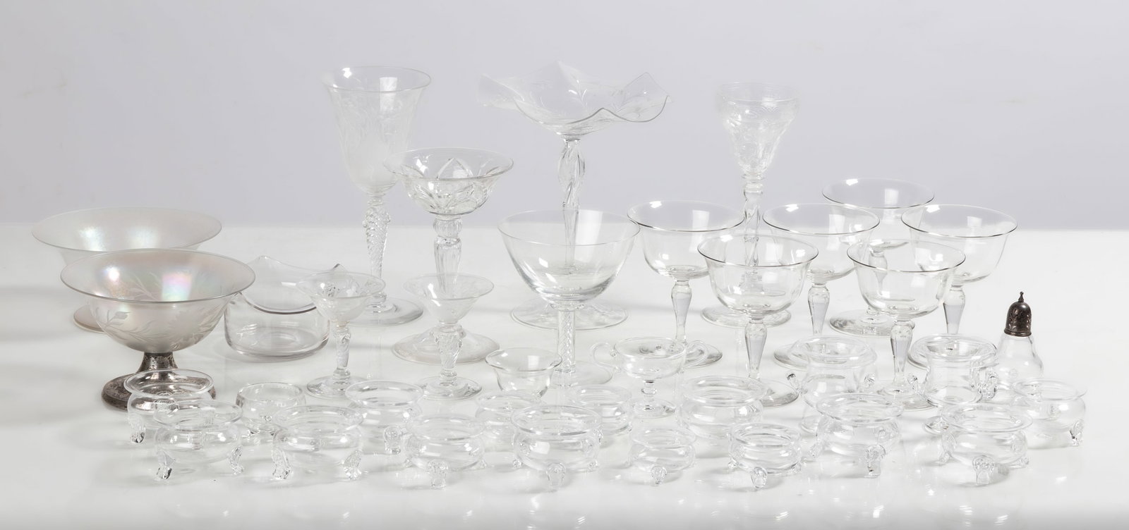 Steuben Tableware: Steuben Tableware Corning, New York, early 20th century. Blown glass. Including engraved and air twist stemware, salt cellars, and master salts. Max 8 x 6 1/2 in. The collection of Bill Mehlenbacher (