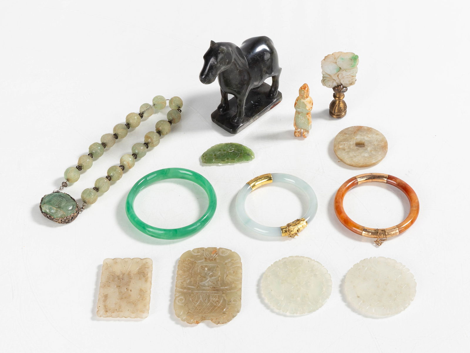 Carved Jade Figures, Bangles, & Pendants: Carved Jade Figures, Bangles, & Pendants Two bangles have 14K gold hardware. Silver clasp on choker is signed. Max L. 12 in. Shipping Note: We provide our own in-house shipping service; separate from