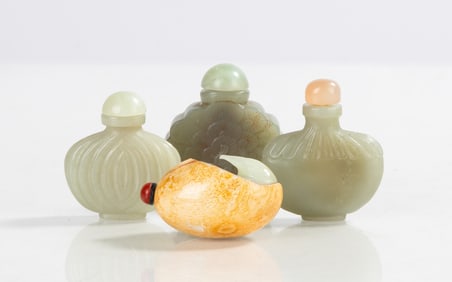 Four Carved Jade Snuff Bottles
