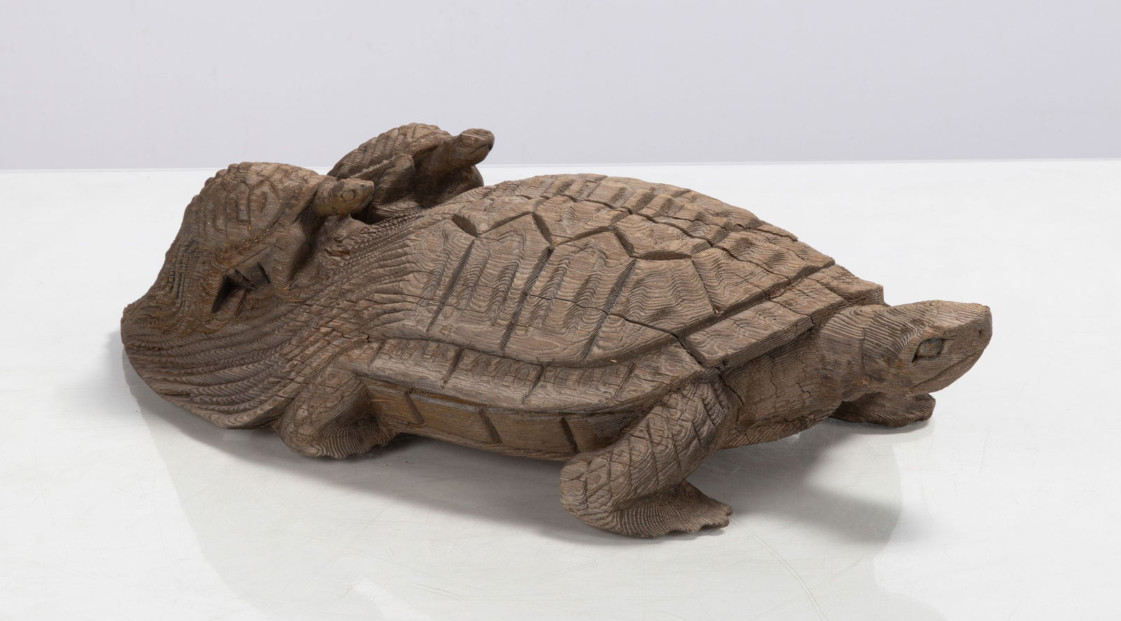 Carved Turtle - Iroquois Mythology: Carved Turtle - Iroquois Mythology Carved wood. L. 17 in. Shipping Note: We provide our own in-house shipping service; separate from LiveAuctioneers. Please reach out to us directly with any inquiries