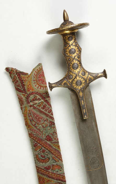 Fine Middle Eastern Cutlass: Fine Middle Eastern Cutlass . Sgn., mixed metal blade w/gold etched symbols. Persian guard. Paisley sheath. Overall L 36" Blade L 33 7/8". The Rochester Historical Society.